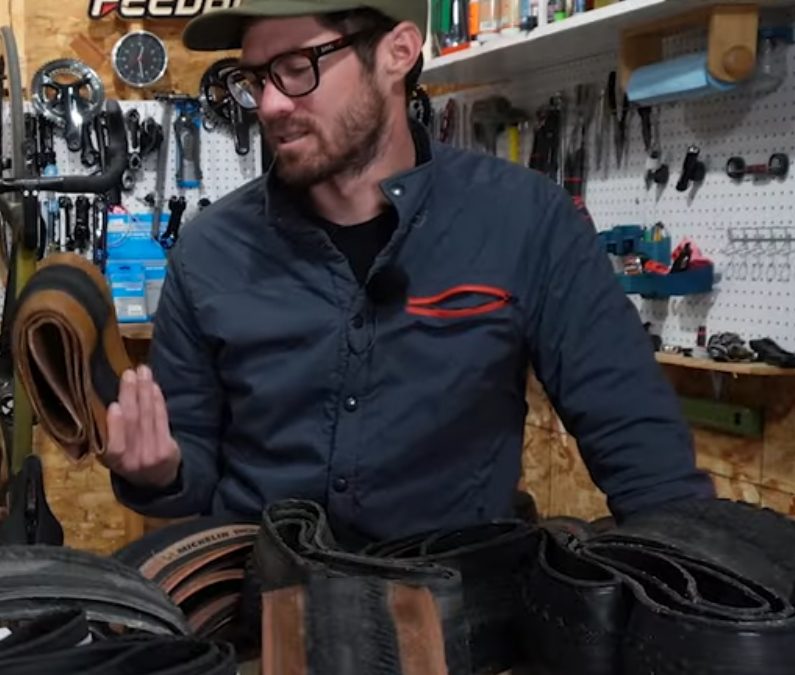 Keith in his Portland shop, tools on the pegboard behind him.