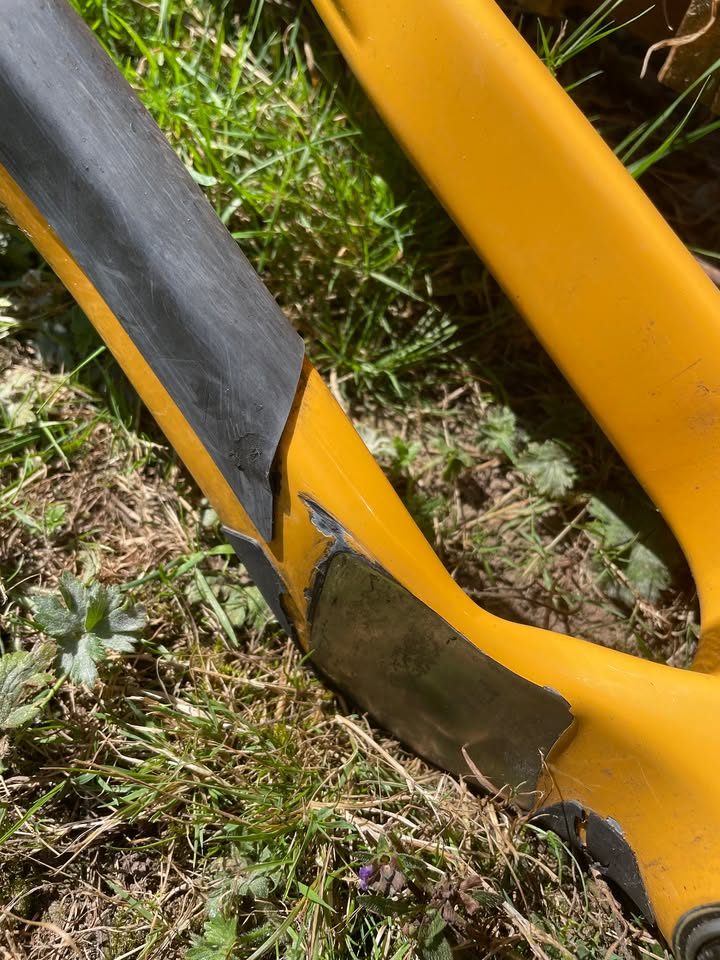 Mustard yellow Canyon Grizl carbon frameset leaning against a wooden fence with its fork, stem and seatpost alongside, from the seller's Marketplace listing. Photo 5 of 5.