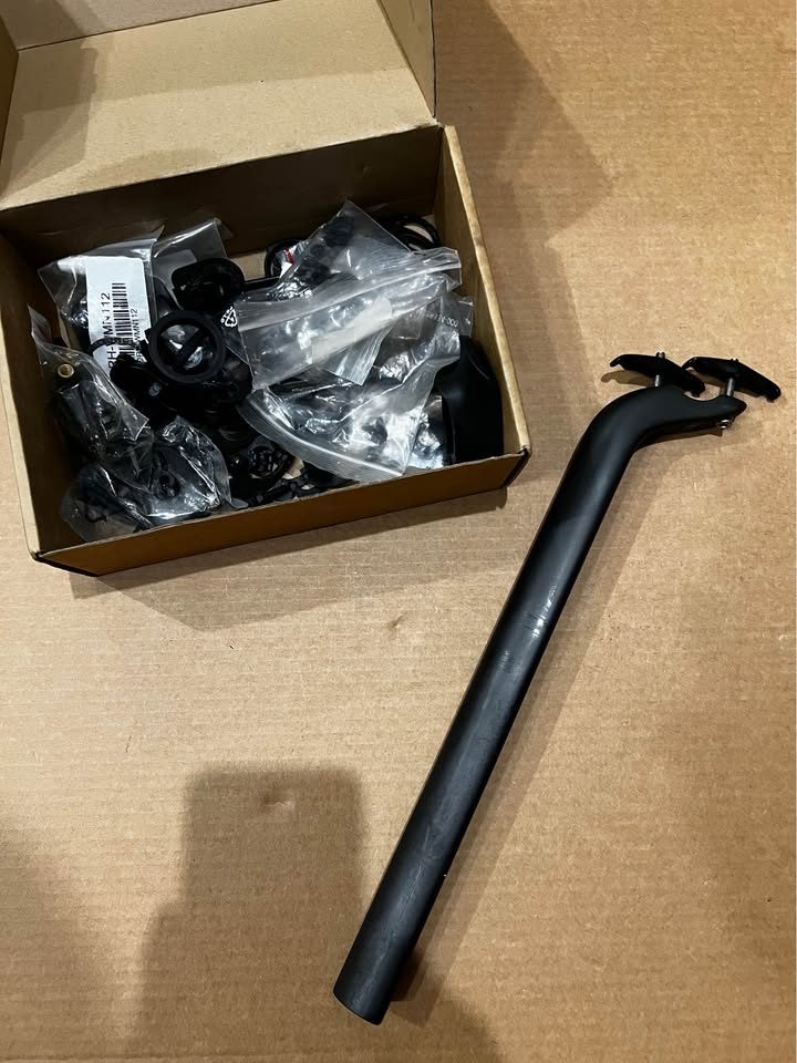 Black Cervélo Caledonia-5 frameset with the bar and stem fitted, leaning against a wall on a wood floor, from the seller's Marketplace listing. Photo 7 of 7.