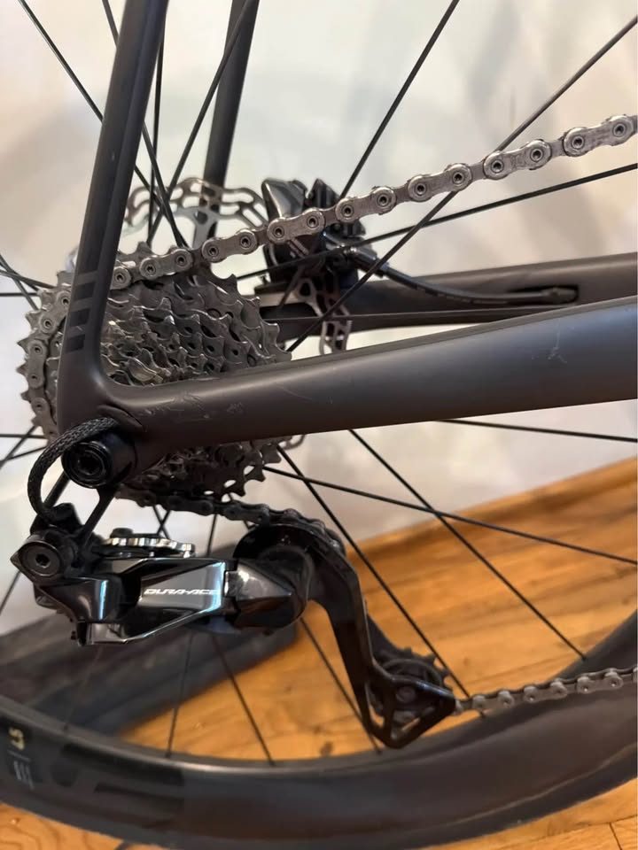 Black Cervélo R5 built up with drop bars and deep carbon wheels, leaning against a wall indoors, from the seller's Marketplace listing. Photo 3 of 4.