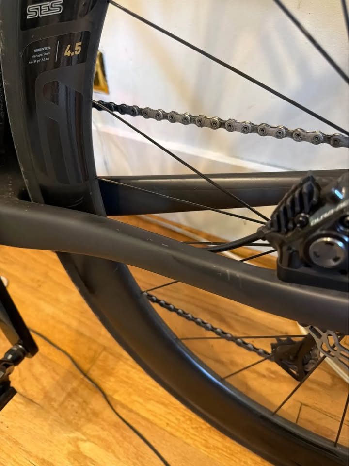 Black Cervélo R5 built up with drop bars and deep carbon wheels, leaning against a wall indoors, from the seller's Marketplace listing. Photo 4 of 4.