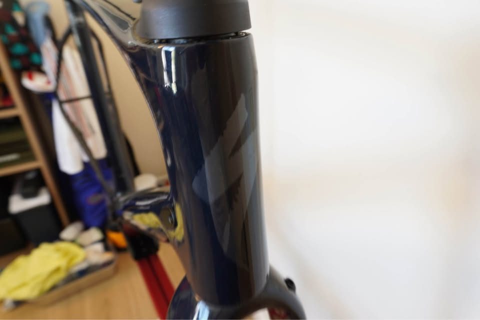 Dark navy Specialized Diverge carbon frame and fork hanging on a workshop stand with the stem fitted and no wheels or drivetrain, from the seller's Marketplace listing. Photo 3 of 5.