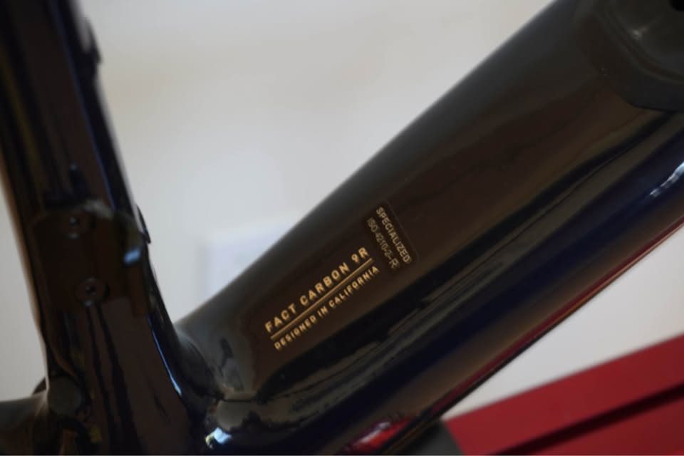 Dark navy Specialized Diverge carbon frame and fork hanging on a workshop stand with the stem fitted and no wheels or drivetrain, from the seller's Marketplace listing. Photo 4 of 5.