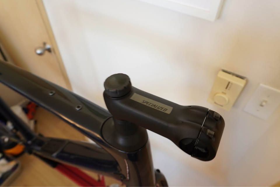 Dark navy Specialized Diverge carbon frame and fork hanging on a workshop stand with the stem fitted and no wheels or drivetrain, from the seller's Marketplace listing. Photo 5 of 5.