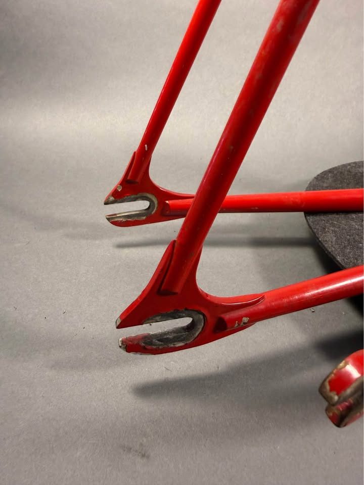 Red lugged steel Masi track frame and matching fork on a grey studio backdrop, MASI in yellow on the down tube and Italian tricolour bands on the seat tube, from the seller's Marketplace listing. Photo 6 of 10.