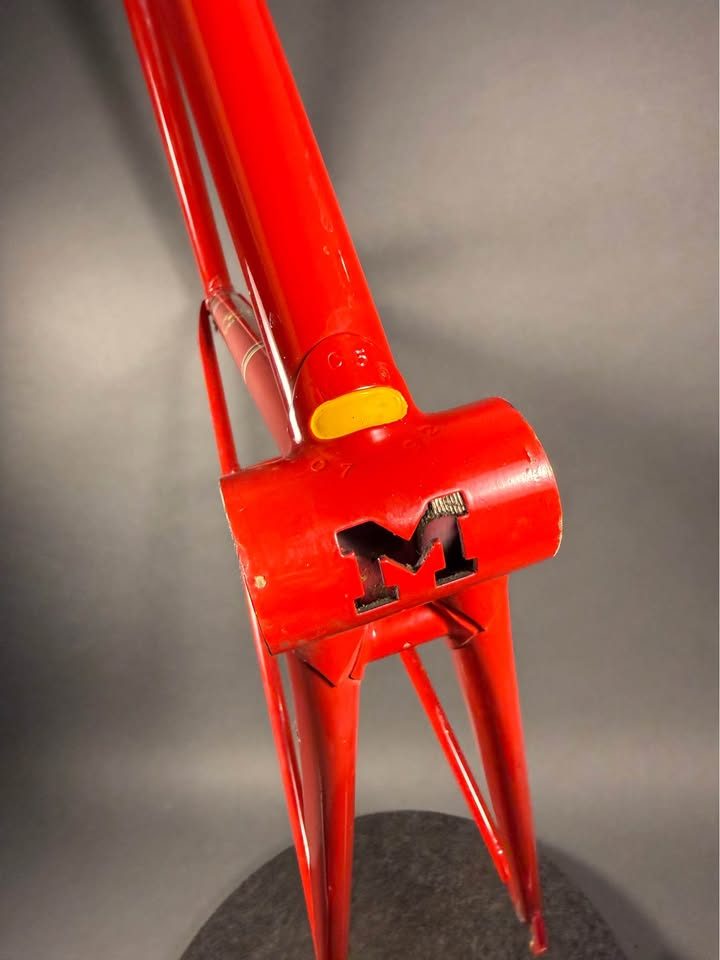 Red lugged steel Masi track frame and matching fork on a grey studio backdrop, MASI in yellow on the down tube and Italian tricolour bands on the seat tube, from the seller's Marketplace listing. Photo 8 of 10.