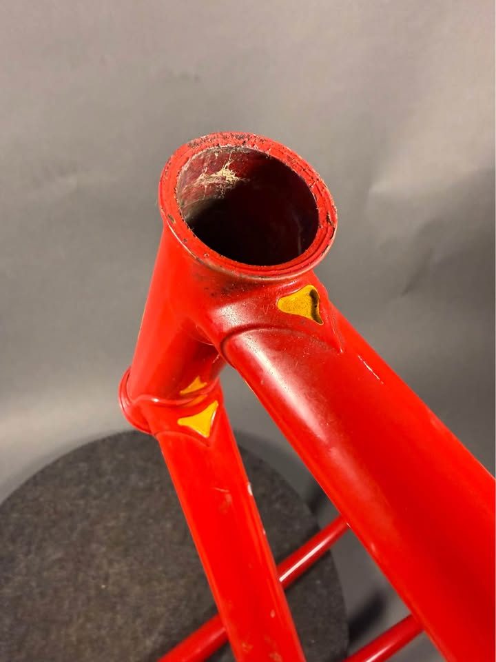 Red lugged steel Masi track frame and matching fork on a grey studio backdrop, MASI in yellow on the down tube and Italian tricolour bands on the seat tube, from the seller's Marketplace listing. Photo 10 of 10.