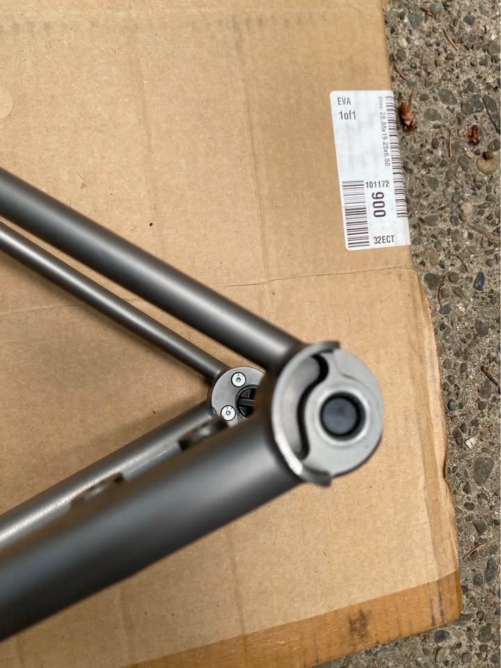Brushed titanium Mosaic road frameset laid out on cardboard next to its purple carbon fork, from the seller's Marketplace listing. Photo 4 of 8.