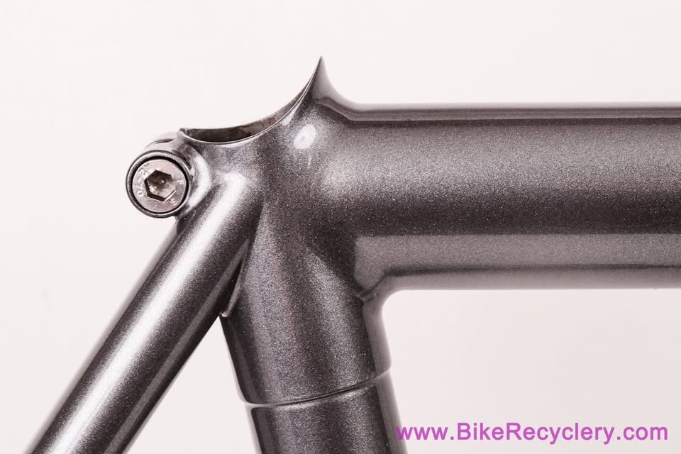 Mark Nobilette steel frame in metallic dark grey with a black carbon fork, on a white background, from Bike Recyclery's Marketplace listing. Photo 4 of 10.