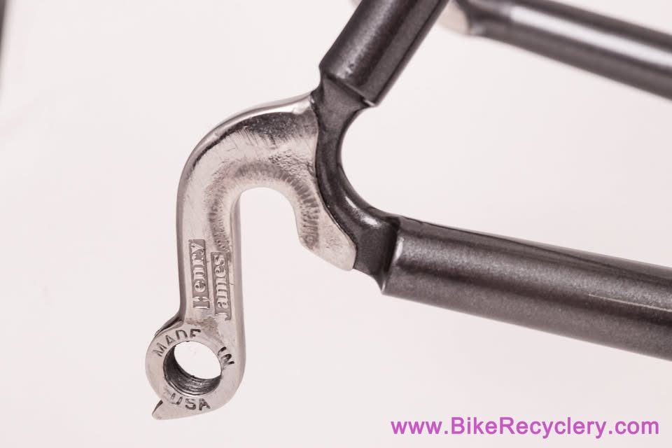 Mark Nobilette steel frame in metallic dark grey with a black carbon fork, on a white background, from Bike Recyclery's Marketplace listing. Photo 5 of 10.