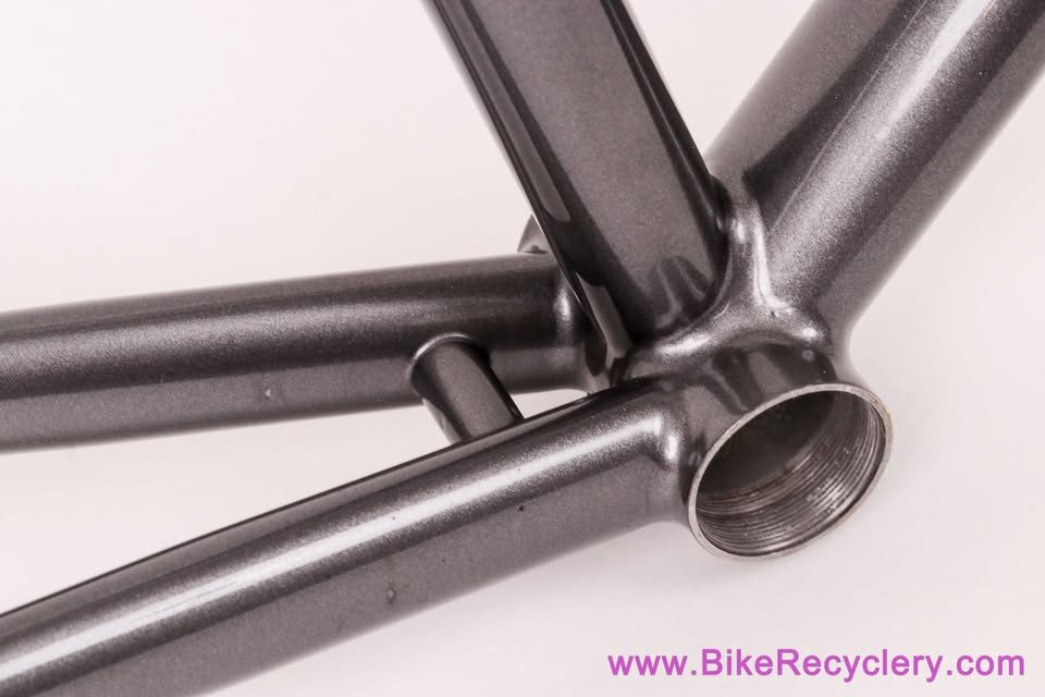 Mark Nobilette steel frame in metallic dark grey with a black carbon fork, on a white background, from Bike Recyclery's Marketplace listing. Photo 6 of 10.