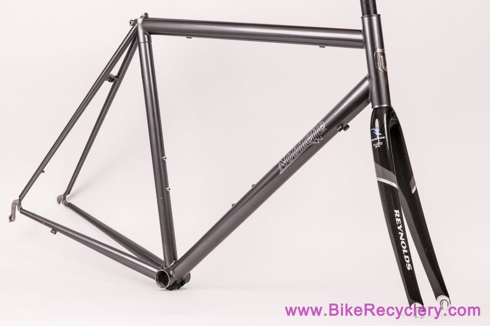 Mark Nobilette steel frame in metallic dark grey with a black carbon fork, on a white background, from Bike Recyclery's Marketplace listing. Photo 9 of 10.