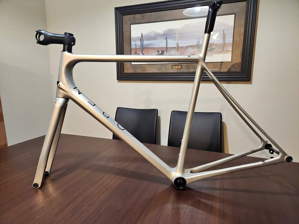 Silver OPEN MIN.D carbon frameset standing on a dining table with its fork, an ENVE stem and a seatpost topper fitted, from the seller's Marketplace listing.