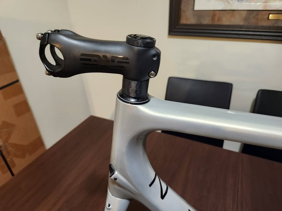 Silver OPEN MIN.D carbon frameset standing on a dining table with its fork, an ENVE stem and a seatpost topper fitted, from the seller's Marketplace listing. Photo 2 of 9.