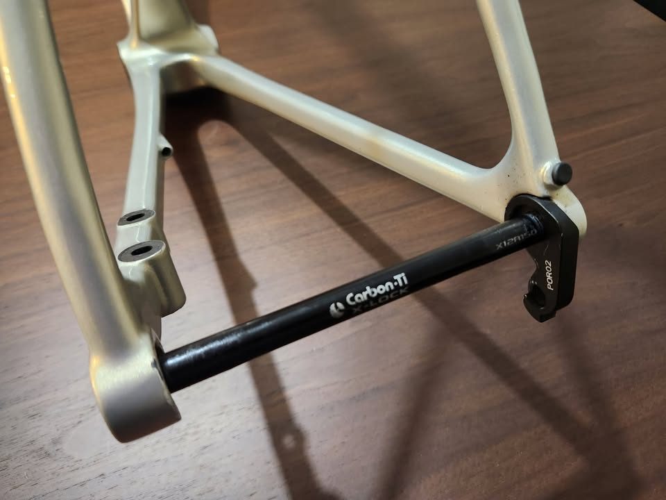 Silver OPEN MIN.D carbon frameset standing on a dining table with its fork, an ENVE stem and a seatpost topper fitted, from the seller's Marketplace listing. Photo 4 of 9.