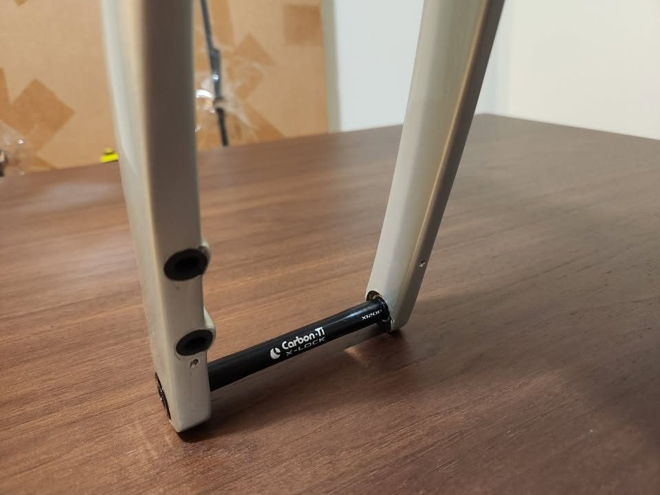 Silver OPEN MIN.D carbon frameset standing on a dining table with its fork, an ENVE stem and a seatpost topper fitted, from the seller's Marketplace listing. Photo 7 of 9.