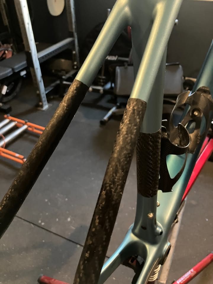 Blue-green Scott carbon frame and fork in a work stand in a garage, with a seatpost, stem and SRAM rear derailleur fitted, from the seller's Marketplace listing. Photo 2 of 6.