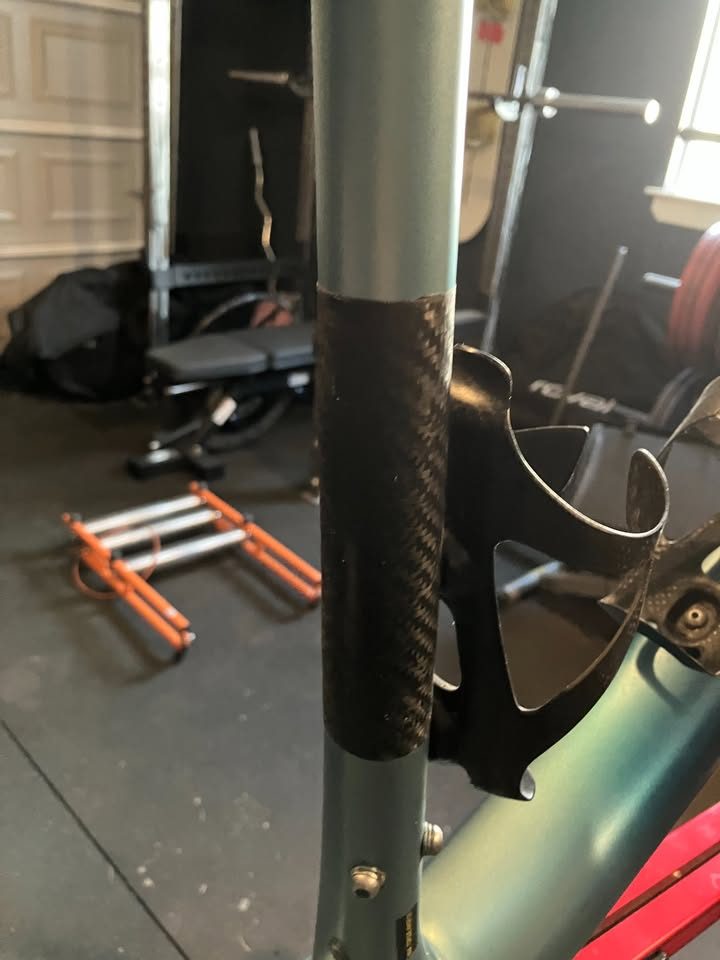 Blue-green Scott carbon frame and fork in a work stand in a garage, with a seatpost, stem and SRAM rear derailleur fitted, from the seller's Marketplace listing. Photo 3 of 6.