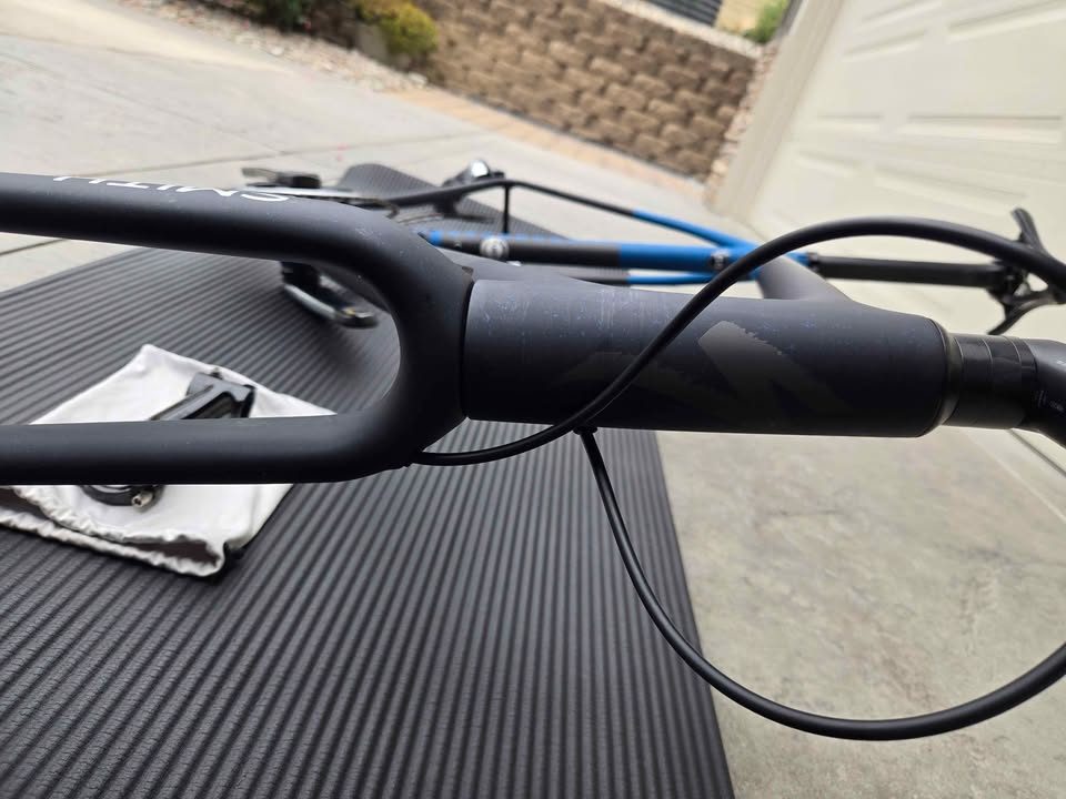Rear triangle of a matte black S-Works Crux frame with blue speckles, a silver flat mount disc caliper bolted to the chainstay, from the seller's Marketplace listing. Photo 5 of 6.
