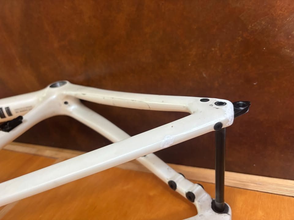 Off-white Specialized Tarmac SL7 frame laid on a dark table with its fork and carbon seatpost alongside, from the seller's Marketplace listing. Photo 3 of 7.