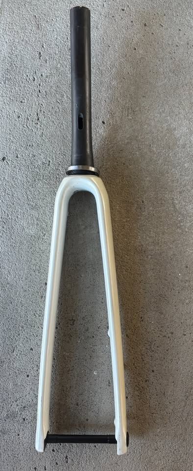 Off-white Specialized Tarmac SL7 frame laid on a dark table with its fork and carbon seatpost alongside, from the seller's Marketplace listing. Photo 4 of 7.