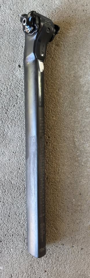 Off-white Specialized Tarmac SL7 frame laid on a dark table with its fork and carbon seatpost alongside, from the seller's Marketplace listing. Photo 5 of 7.